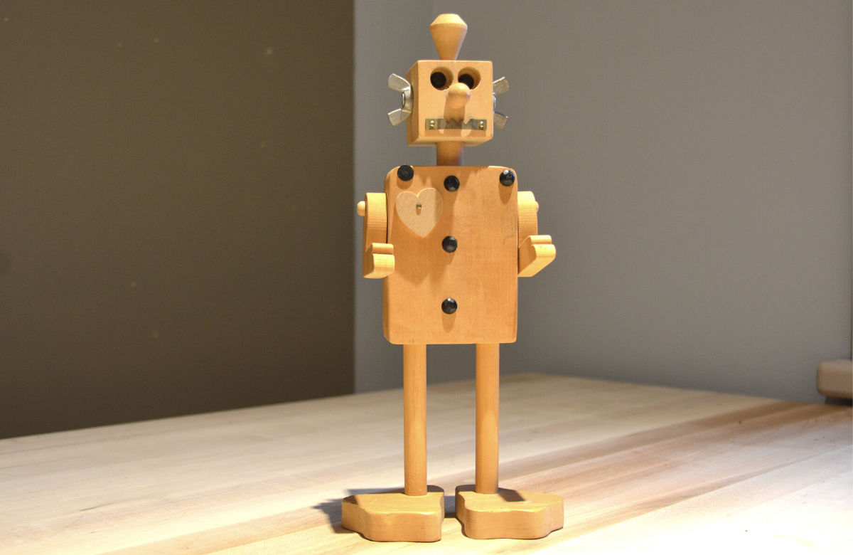 Rectangular wooden robot with wooden duck feet