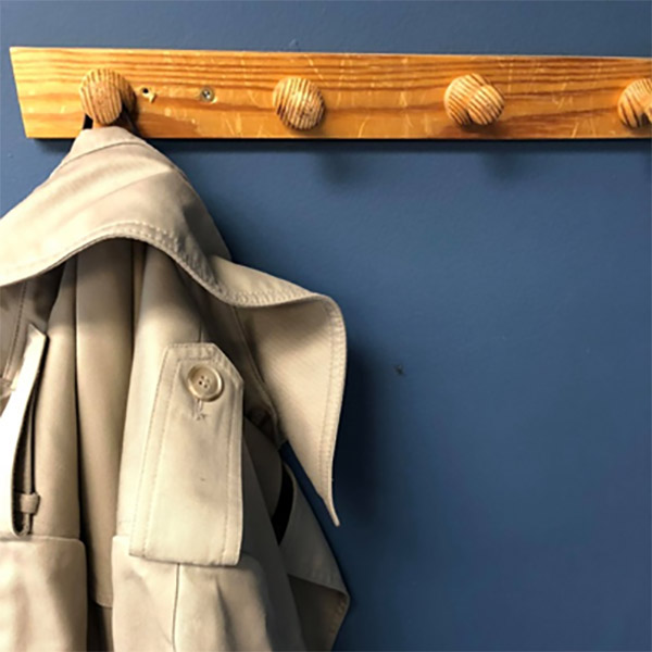 Sandy MacLachlan's trench coat hanging in the office at the museum