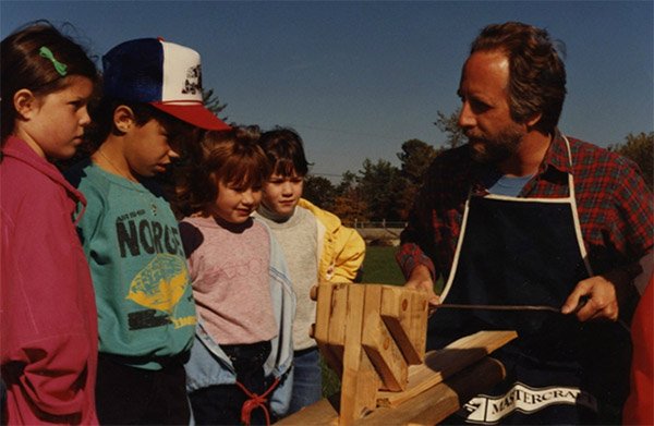 Students from Prince Edward School learn to use the shaving horse and drawknife, 1987